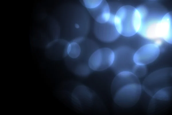 Blå cirklar på en mörk bakgrund — Stockfoto