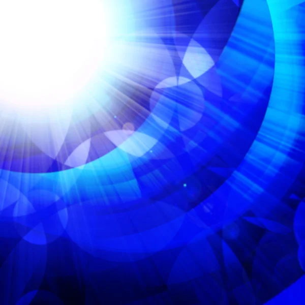 Círculos azuis com raios brilhantes de luz — Fotografia de Stock