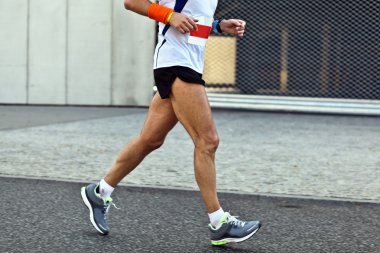 Man running in city marathon, blurred motion clipart