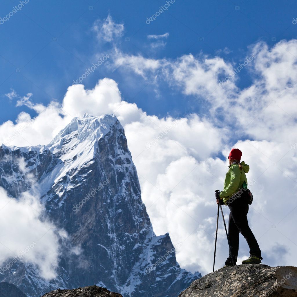 Woman hiking in Himalaya Mountains, sport and fitness travel