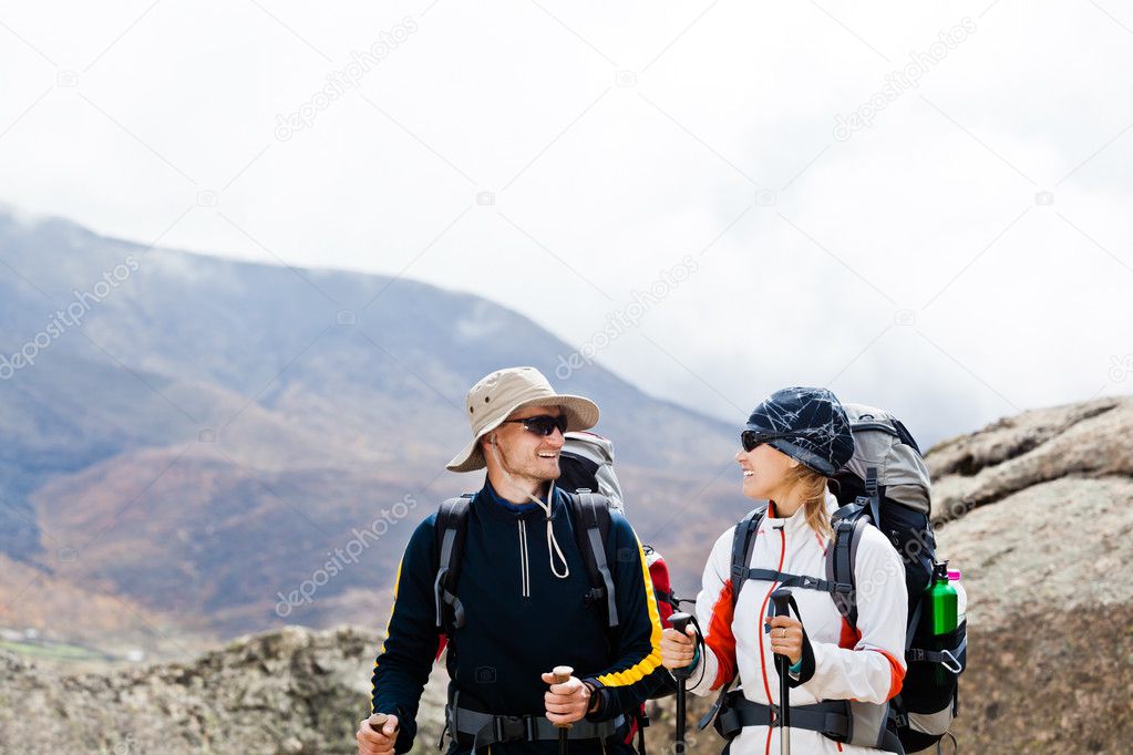 Man and woman hiking in mountains