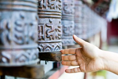 Prayer wheel in monastery, Nepal clipart