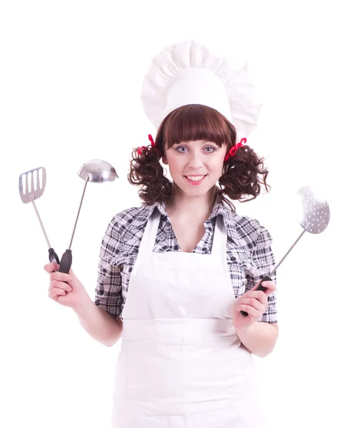 Woman holds a cooking spoon and kitchen utensil — Stock Photo, Image