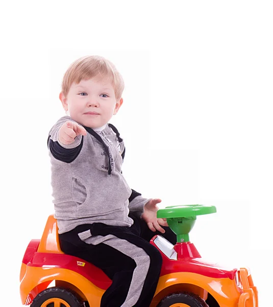 Baby boy with a big car on white background — Stock Photo, Image