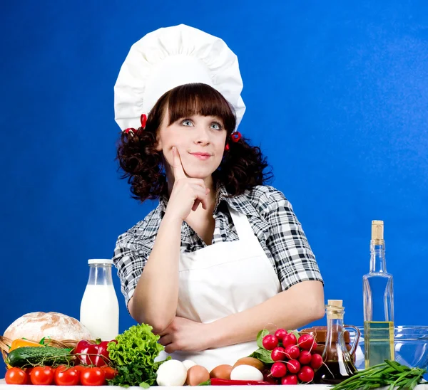 Smiling happy cook woman with food ingredients — Stock Photo, Image