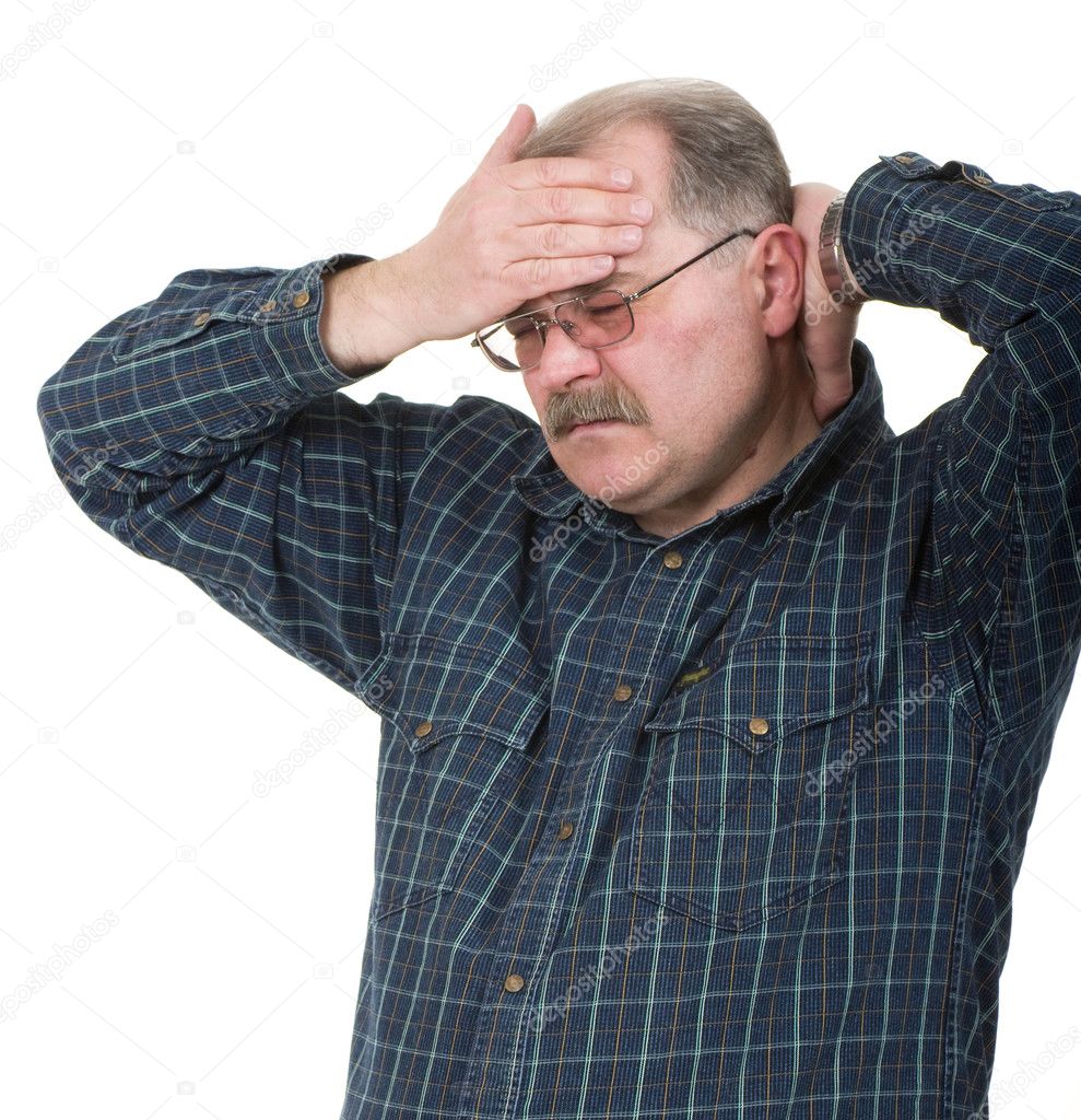 Portrait of old man having a headache