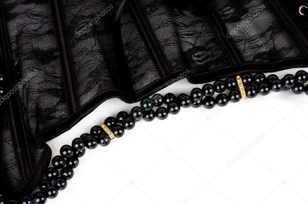 Black lace with form flower, pearls on white background
