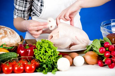 Cook woman holds a Crude Hen clipart