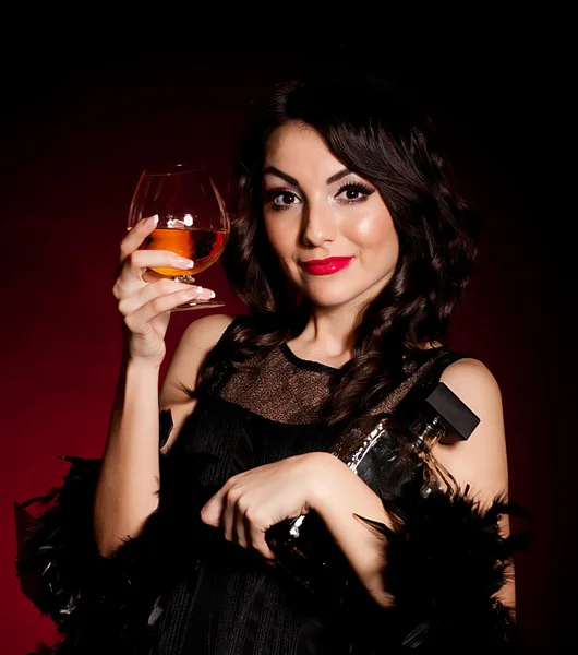 Vintage woman in retro dress with cognac . — Stock Photo, Image