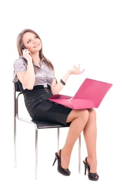 Businesswoman with telephone on chair — Stock Photo, Image