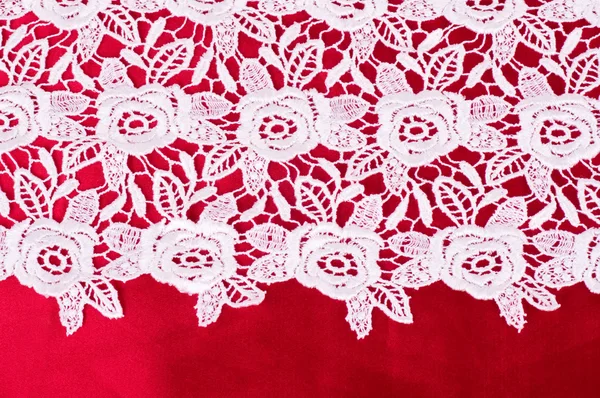Vintage lace with flowers on red background — Stockfoto