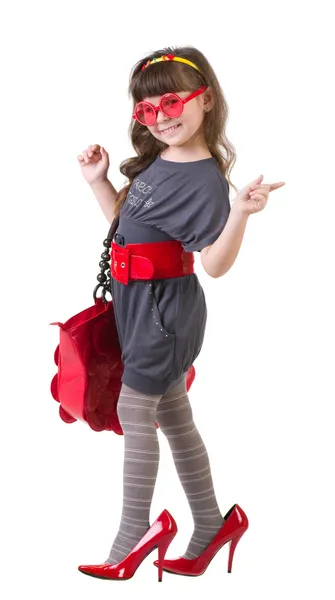 Funny little girl trying — Stock Photo, Image