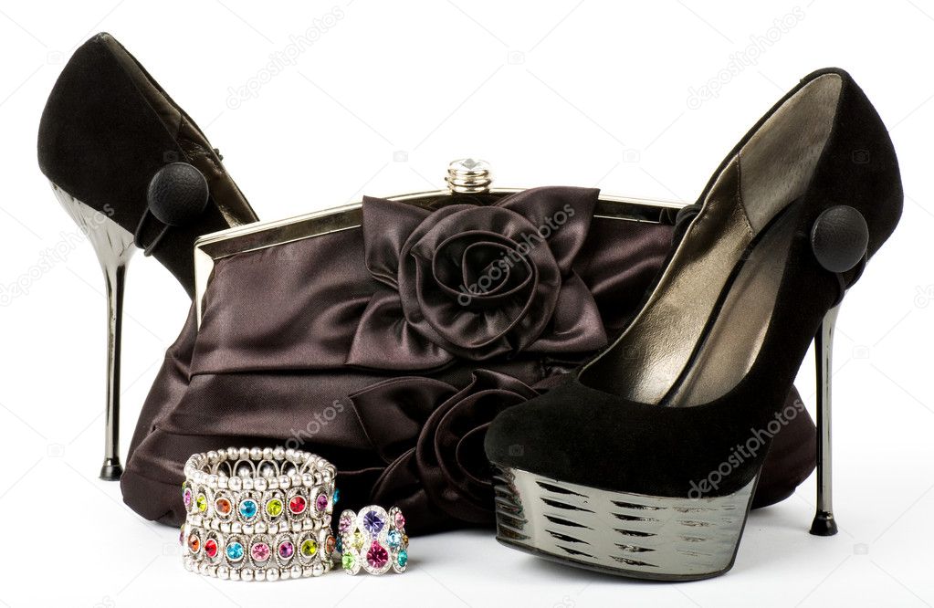 Sexy fashionable shoes, golden jewelry and handbag isolated on white background.