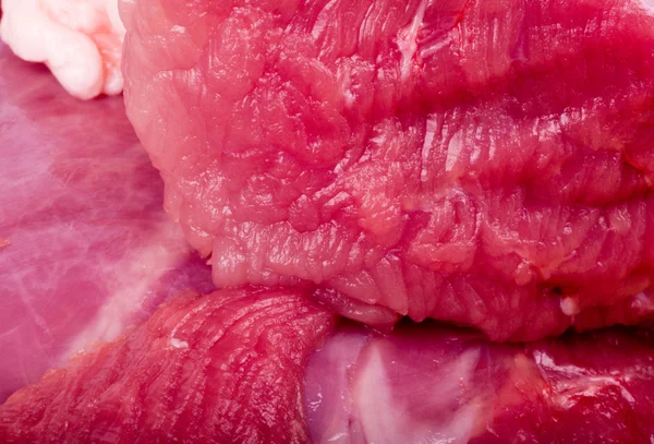 Hovězí syrové červené maso closeup pozadí — Stock fotografie