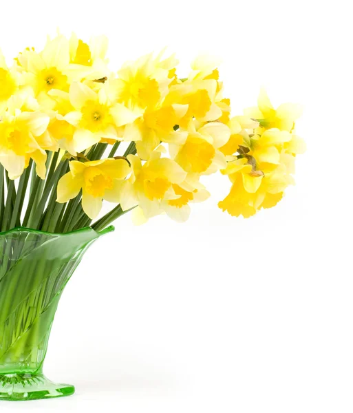 Lindas flores amarelas de primavera em um vaso de vidro — Fotografia de Stock