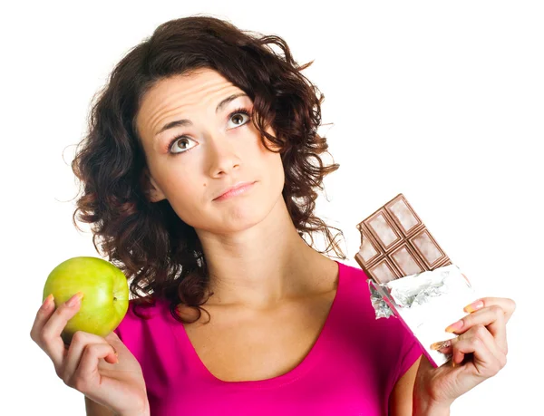 Meisje met apple en chocolade — Stockfoto