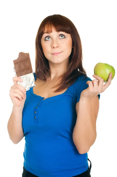 Menina com maçã e chocolate — Fotografia de Stock