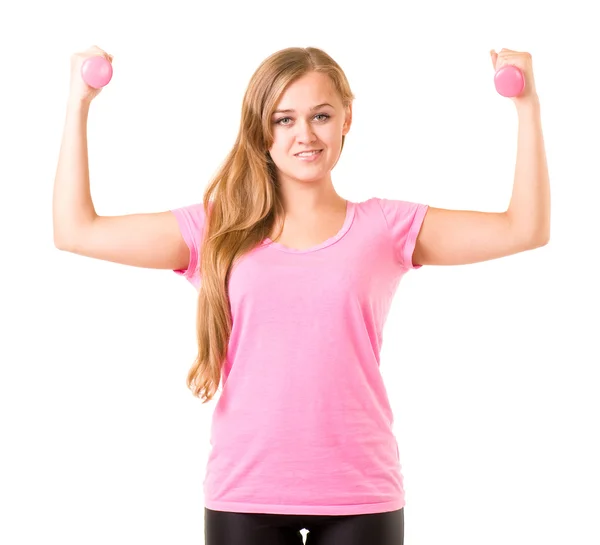 Chica sonriente con pesas libres en el gimnasio — Foto de Stock