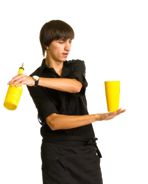 Bartender does a trick with a shaker and bottle — Stock Photo, Image