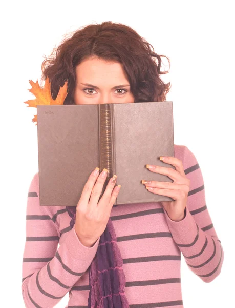 Menina sorridente com livro sobre fundo branco — Fotografia de Stock