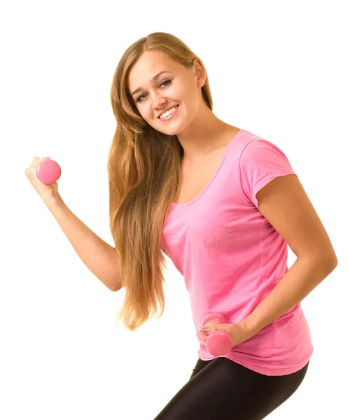 Krásná usměvavá dívka s činkami v tělocvičně — Stock fotografie