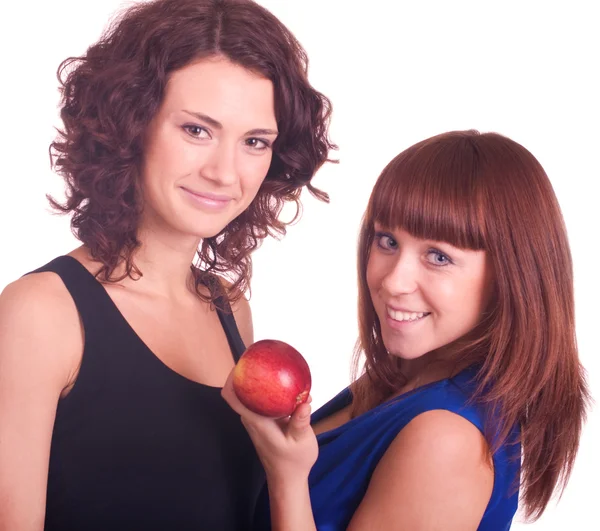 Vackra leende flickor med äpple — Stockfoto
