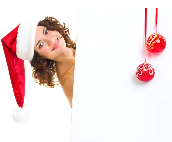 산타 클로스 옷 빈 보드에 기대어 있는 여자 — 스톡 사진