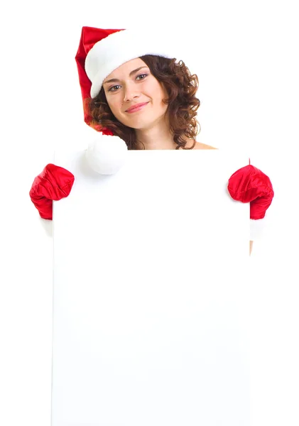 Donna in abiti di Babbo Natale appoggiata sulla lavagna bianca — Foto Stock