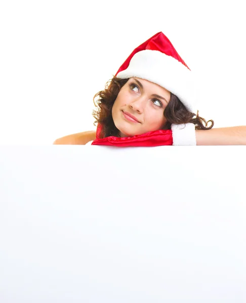 Woman in Santa Claus clothes leaning on blank board — Stock Photo, Image