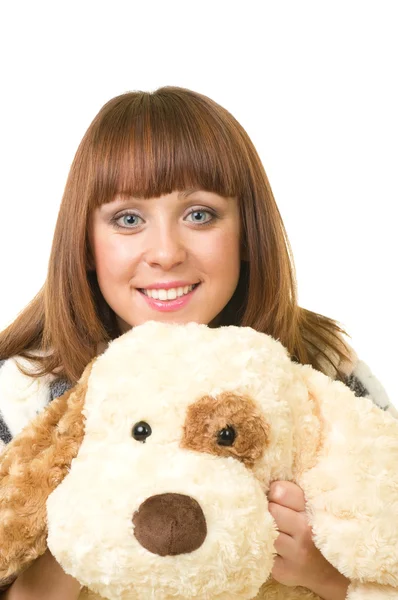 Beautiful young girl with toy dog — Stock Photo, Image