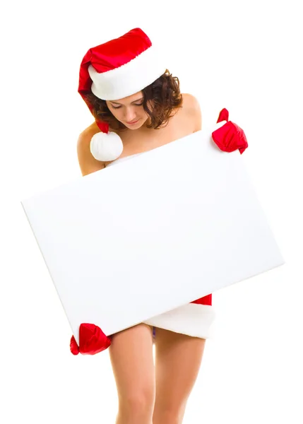 Frau in Weihnachtsmannkleidung lehnt sich an leeres Brett — Stockfoto