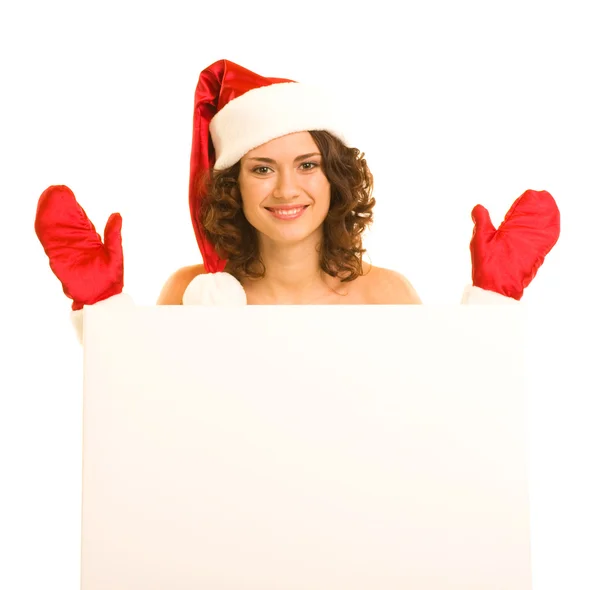 Donna in abiti di Babbo Natale appoggiata sulla lavagna bianca — Foto Stock
