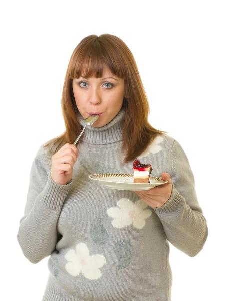 Krásná mladá žena jíst chutné koláče — Stock fotografie