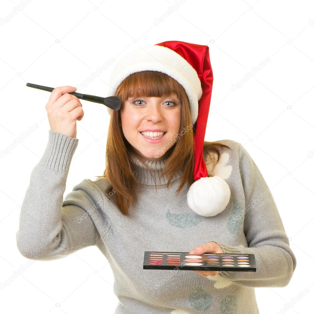 Woman in Santa Claus clothes with beauty cosmetics