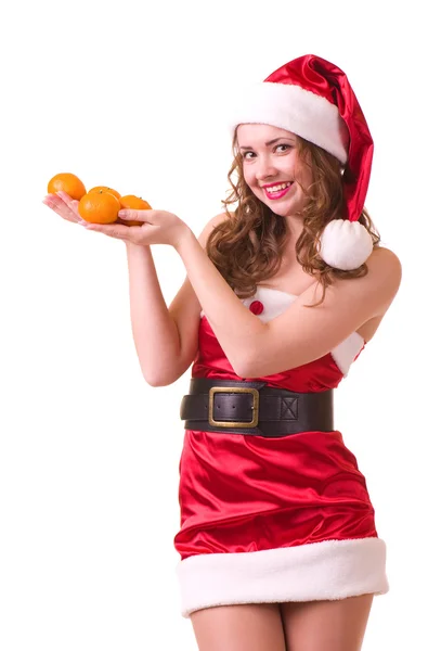 Kvinna i santa claus kläder med apelsin mandarin — Stockfoto