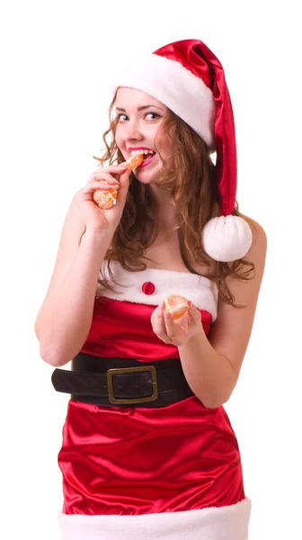 Mulher em roupas de Papai Noel com mandarina laranja — Fotografia de Stock