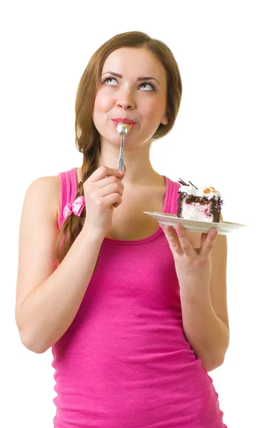 The beautiful young woman eat tasty cake Stock Image
