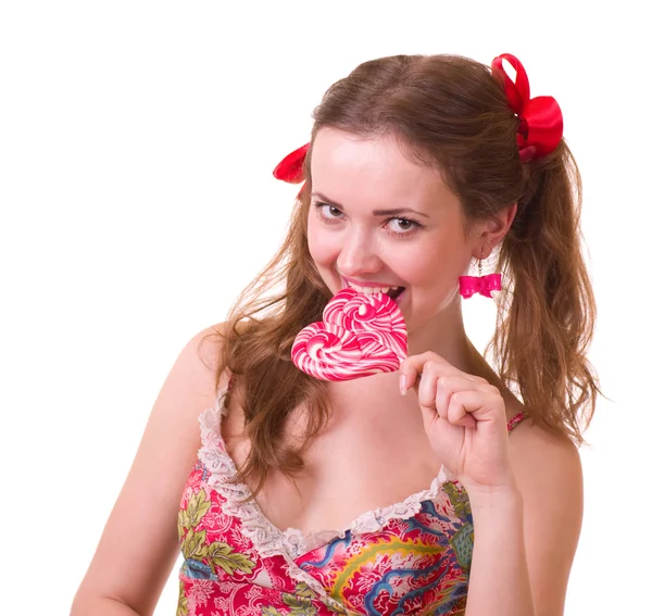 Schönes junges Mädchen mit rosa Spirallutschern — Stockfoto