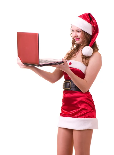 Meisje in santa claus kleren met laptop — Stockfoto