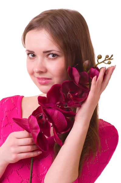 Young girl with orchid on white background. — Stock Photo, Image