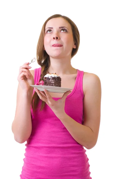 De mooie jonge vrouw eten smakelijke taart — Stockfoto