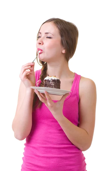 The beautiful young woman eat tasty cake Royalty Free Stock Images