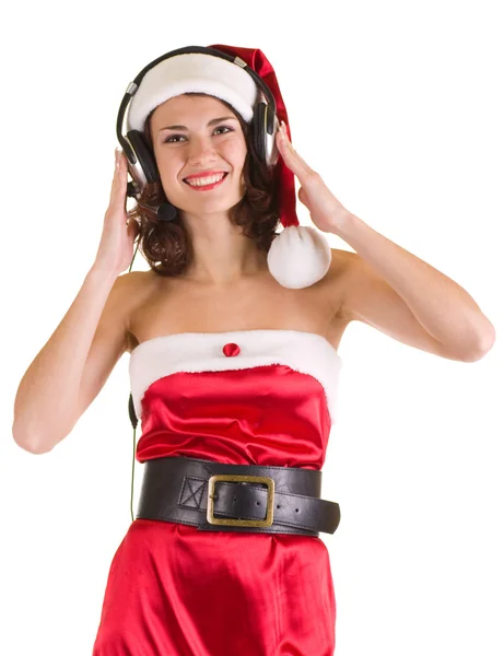 Girl in Santa Claus clothes with headphones is listen to the music — Stock Photo, Image