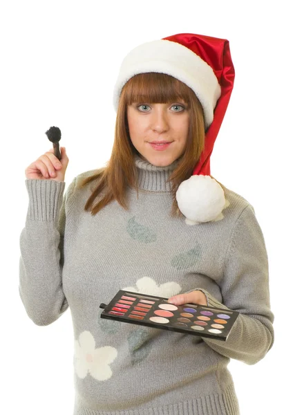 Femme dans les vêtements du Père Noël avec des cosmétiques de beauté — Photo