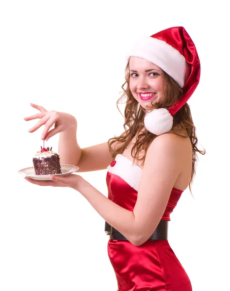 Flicka i santa claus kläder med välsmakande kaka — Stockfoto