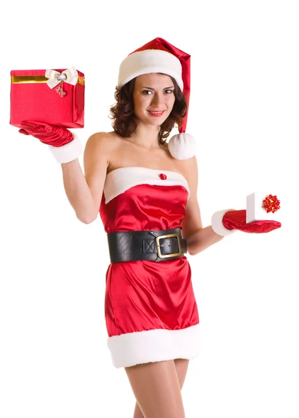 Vacker ung flicka i santa claus kläder med gåvor — Stockfoto