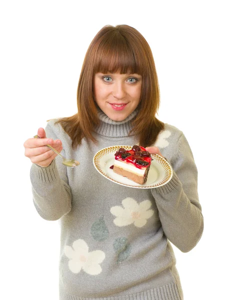 美しい若い女性はおいしいケーキを食べる — ストック写真