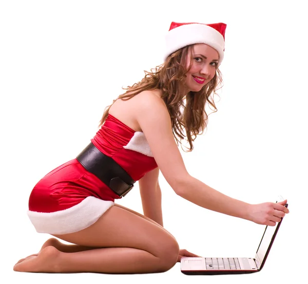 Fille dans les vêtements du Père Noël avec ordinateur portable — Photo