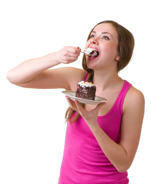 A bela jovem mulher come bolo saboroso — Fotografia de Stock