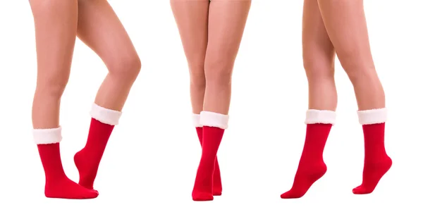Sexy piernas en el calcetín de Santa Claus aislado —  Fotos de Stock